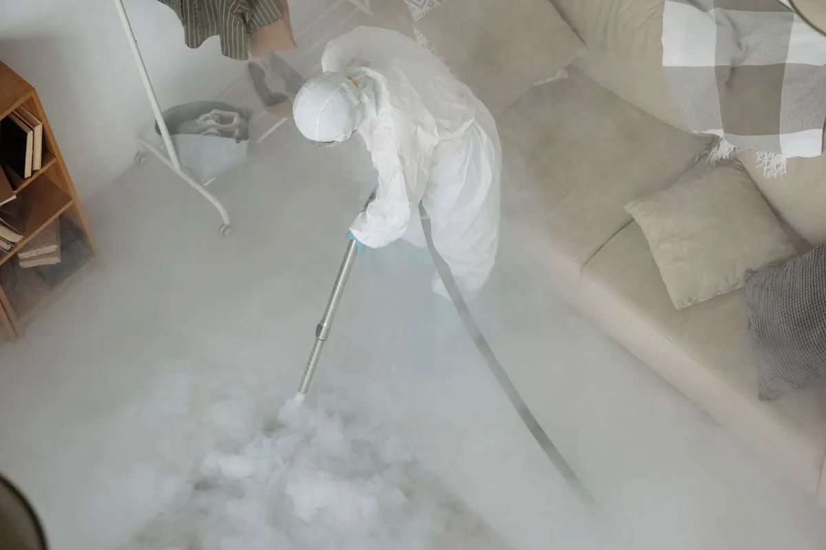 Biohazard cleanup technician in protective equipment, Lents, Portland, OR